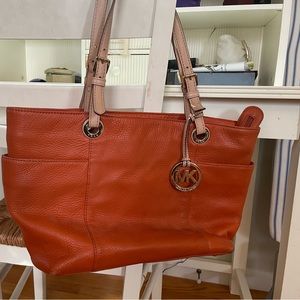 Michael Kors orange pebble leather tote with zip gold interior